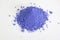 Bright ultramarine pigment isolated over white