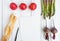 Bright vegetables and a cookbook page on white background. Healthy food for salad. Flat lay, top view, view from above