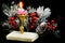 Bright vintage Christmas candle, a symbol of faith, hope, love and elegant winter snow-covered spruce branch, a traditional