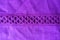 Bright violet linen fabric with stripe of crochet lace