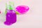 Bright violet slime spilling of from the bottle. Elastic glue with glitter worldwide popular kids toy