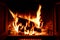 Bright and warm melted fireplace with flames and sparks
