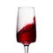 Bright wave of red wine in a high glass on a thin leg