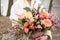Bright wedding rustic bouquet in hand of a bride