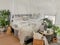 Bright white bedroom filled with numerous houseplants and flooded in natural light