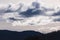 Bright white and contrasty clouds formation coming and going across a stormy