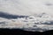 Bright white and contrasty clouds formation coming and going across a stormy