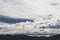 Bright white and contrasty clouds formation coming and going across a stormy