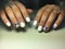 bright white manicure with delicate blue flowers