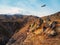 Bright white snowy peak of Mount Elbrus above the autumn rocky plateau. Autumn Elbrus. Autumn in the Caucasus mountains. White