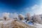 Bright winter scenery, with frozen river and trees