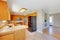 Bright wooden kitchen room interior designed in beige color.