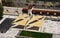 Bright yellow area awnings or sun sails over public terrace and streetscape