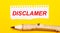 On a bright yellow background, a large wooden pencil and a sheet of torn paper with the text DISCLAIMER