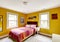 Bright yellow bedroom interior
