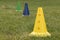 Bright yellow, blue and green plastic sports cones