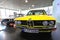 Bright yellow BMW 5 series classic sedan on display at BMW Museum