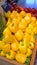 Bright Yellow Capsicum with Red ones in the Background