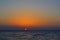 Bright yellow circle of sun pink orange red dawn, sunset at sea, ocean, sky gradient, evening