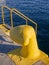 Bright yellow dock tie and yellow stairs on the pier