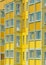 Bright yellow facade of a typical high-rise building