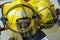 Bright yellow fire fighter helmets at a fire station house