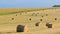 Bright yellow and golden Haystacks on agricultural field in sunny autumn day. Haystacks on the field, close-up view