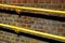 Bright Yellow Handrails Fixed To A Red Brick Wall