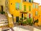 Bright yellow houses in the Villefranche-sur-Mer, of the Cote d`Azur, France