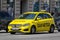 Bright yellow Mercedes-Benz B Class taxi cab in centre of Vienna city
