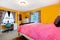 Bright yellow and pink young adult room