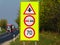 Bright yellow and red color traffic signs. 70 km speed limit