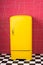 Bright yellow refrigerator in pink interior. Retro fridge looks awesome in modern interior. Stylish interior details