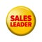 Bright yellow round button with word `Sales leader`