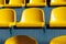 Bright yellow seats of the visual zone in the stadium close-up.