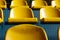 Bright yellow seats of the visual zone in the stadium close-up.