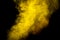 Bright yellow smoke isolated on black background is macro