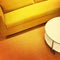 Bright yellow sofa and coffee table