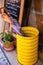 Bright yellow umbrella stand with plant