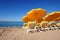 Bright yellow umbrellas on a sand beach