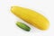Bright yellow zucchini and green cucumber. Penis size concept in men, penis enlargement