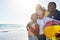 The brightest days are spent with family. an adorable little girl having fun with her parents on the beach.