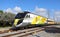 Brightline train traveling south