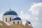 Brightly blue coloured greek chapels on Santorin