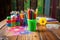 brightly colored childrens art supplies on a wooden table