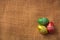 Brightly colored Easter eggs on a brown sackcloth