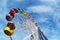 Brightly colored Ferris wheel against the sky