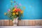 brightly colored flowers against pueblo wall