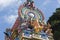 Brightly colored Hindu-themed statues outside of Batu Caves