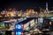 Brightly colored lights of Old Port Genoa at night